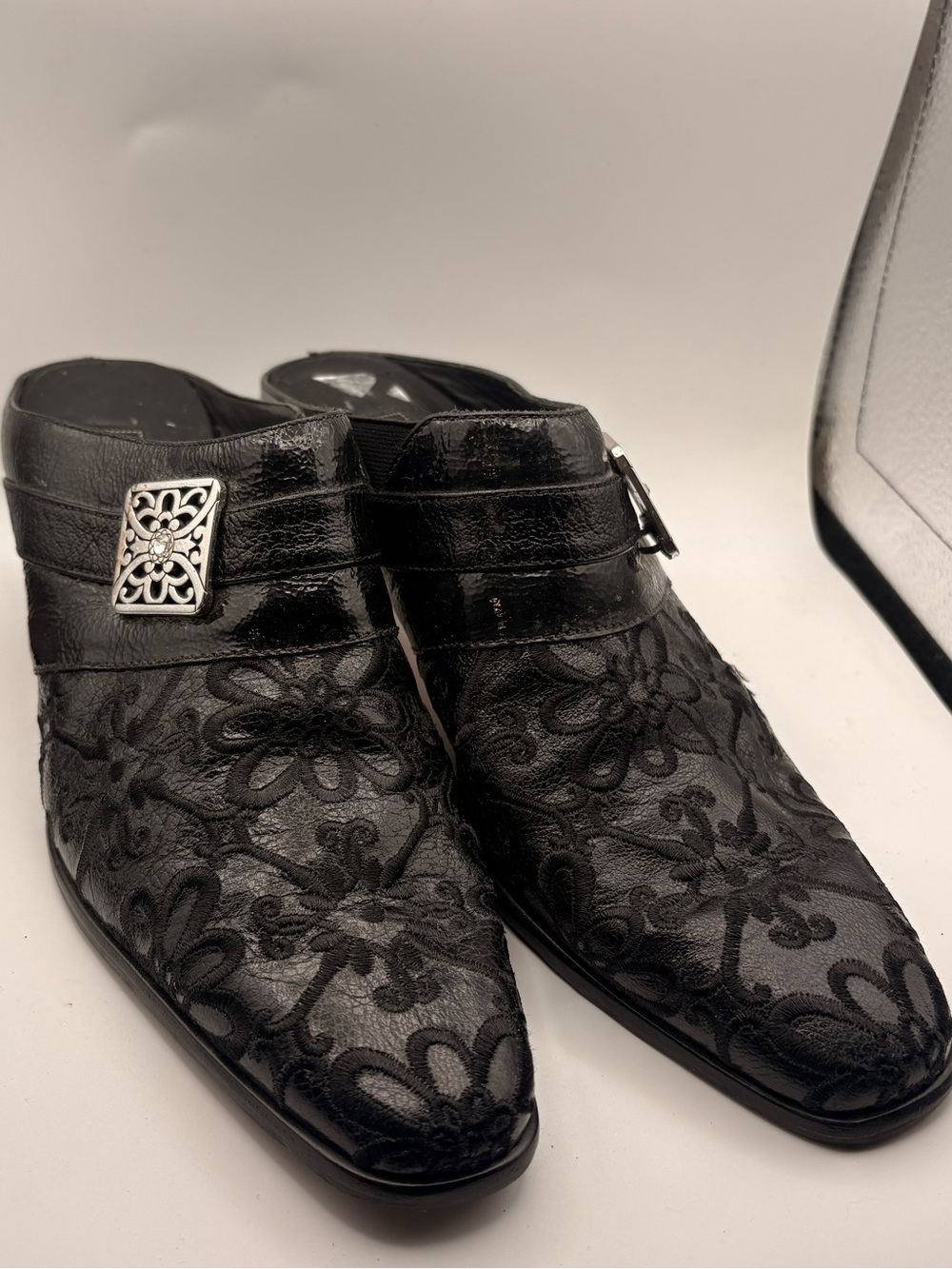 Brighton Black Floral Lace Slip-On Loafers with Silver Accent